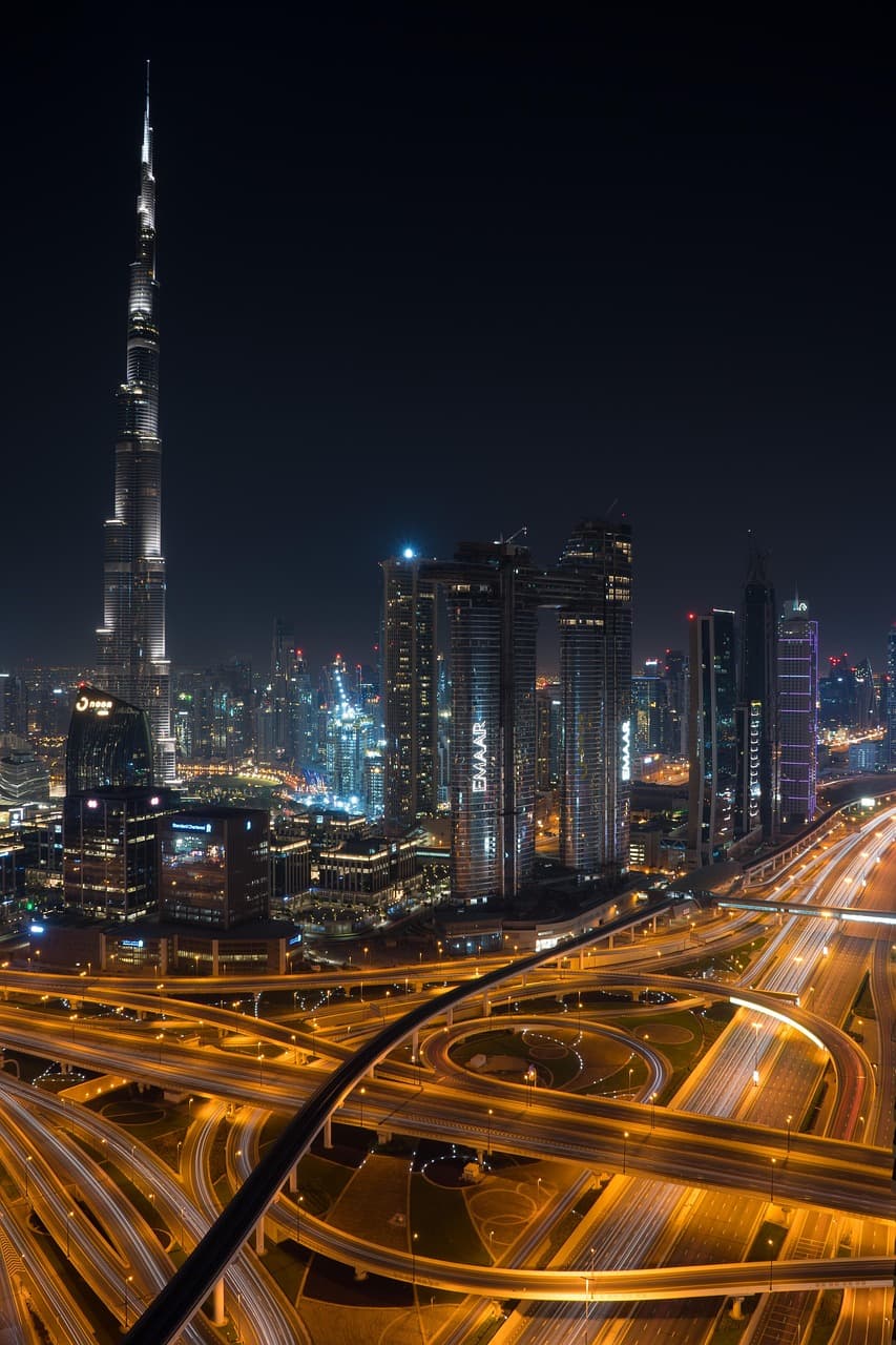 Diverse team of AI professionals collaborating in a Dubai office - employers hiring through AIJobsUAE